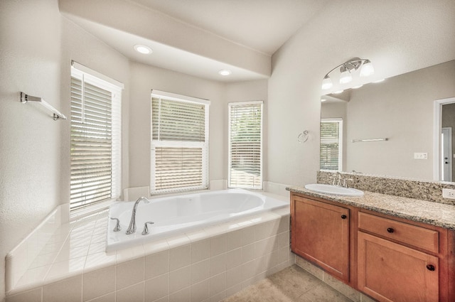 439 W Serena Ave, Clovis, CA 93619 - bathroom featuring vanity, a garden tub, tile patterned flooring, and recessed lighting