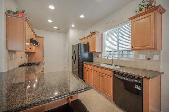 439 W Serena Ave, Clovis, CA 93619 - kitchen with black appliances, under cabinet range hood, decorative backsplash, recessed lighting, and dark stone countertops