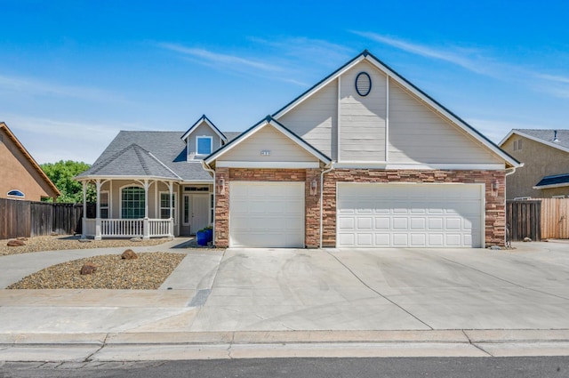 439 W Serena Ave, Clovis, CA 93619 - view of front of property featuring covered porch, concrete driveway, and a garage