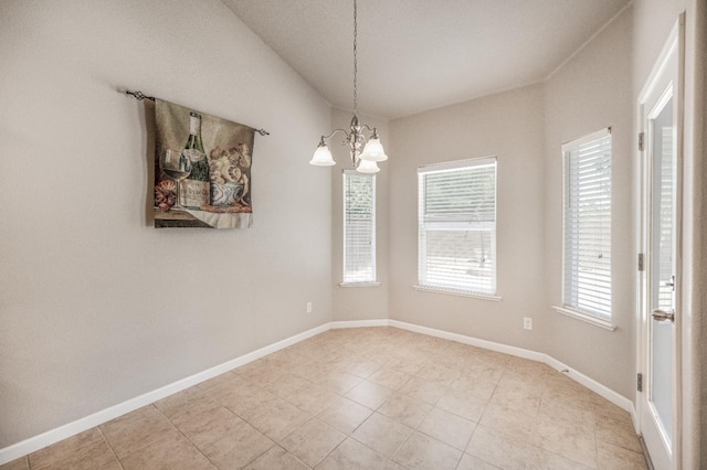 439 W Serena Ave, Clovis, CA 93619 - unfurnished dining area with plenty of natural light, a chandelier, and light tile patterned floors