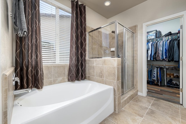 3143 Celeste Ave, Clovis, CA 93619 - full bathroom featuring a garden tub, a shower stall, a walk in closet, and recessed lighting