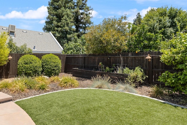 3143 Celeste Ave, Clovis, CA 93619 - fenced backyard featuring a vegetable garden