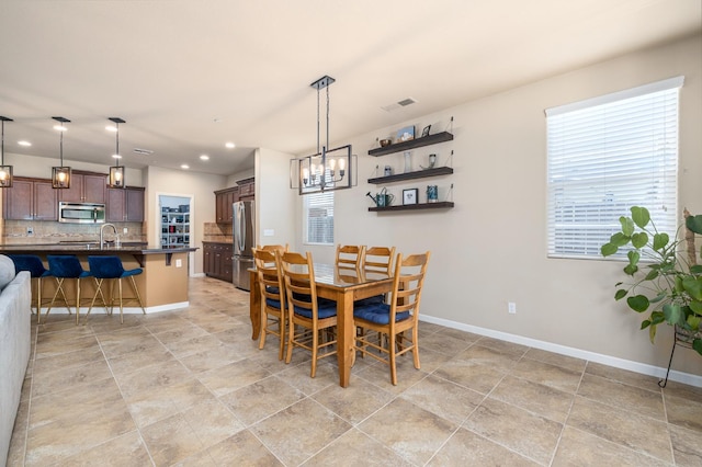 3143 Celeste Ave, Clovis, CA 93619 - dining space featuring a chandelier and recessed lighting