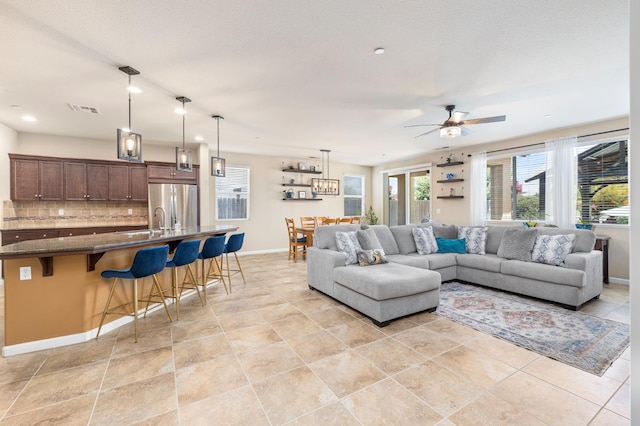 3143 Celeste Ave, Clovis, CA 93619 - living room with a ceiling fan, light tile patterned floors, and recessed lighting