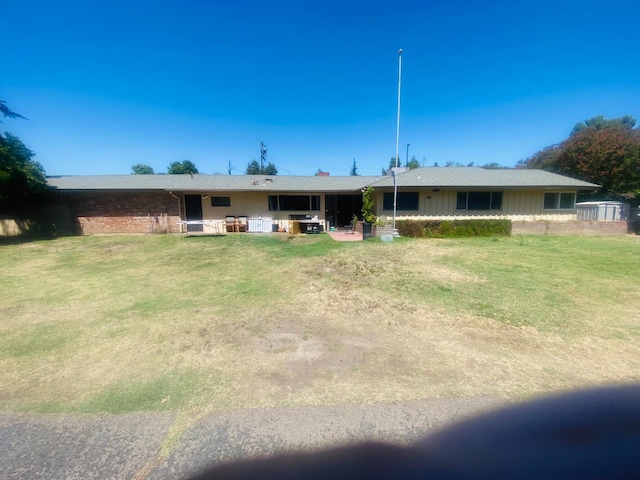 4005 N 1st, Fresno, CA 93726 - rear view of property featuring a yard, board and batten siding, and brick siding