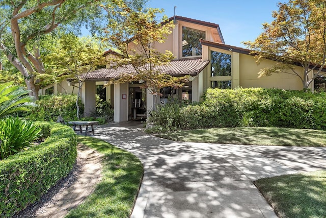 5630 N El Adobe Dr, Fresno, CA 93711 - view of front of house with stucco siding and a tiled roof