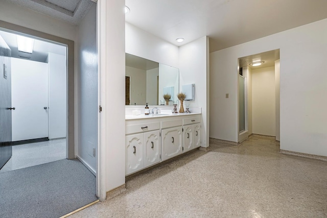 5630 N El Adobe Dr, Fresno, CA 93711 - bathroom featuring carpet floors, vanity, and a shower with shower door