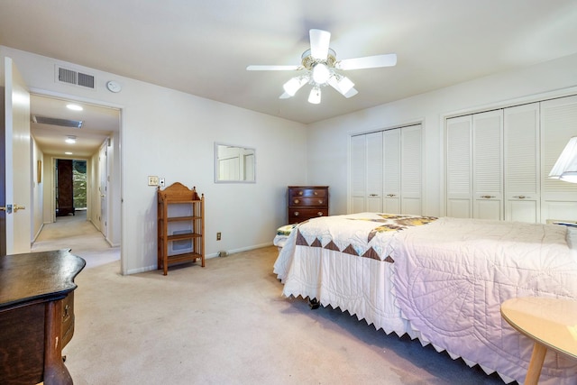 5630 N El Adobe Dr, Fresno, CA 93711 - bedroom featuring two closets, light carpet, and a ceiling fan