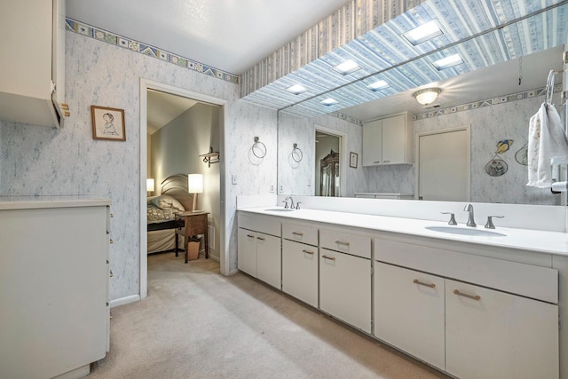 5630 N El Adobe Dr, Fresno, CA 93711 - full bath featuring wallpapered walls, connected bathroom, and double vanity