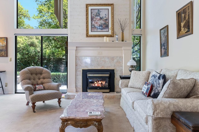 5630 N El Adobe Dr, Fresno, CA 93711 - carpeted living room with healthy amount of natural light and a fireplace