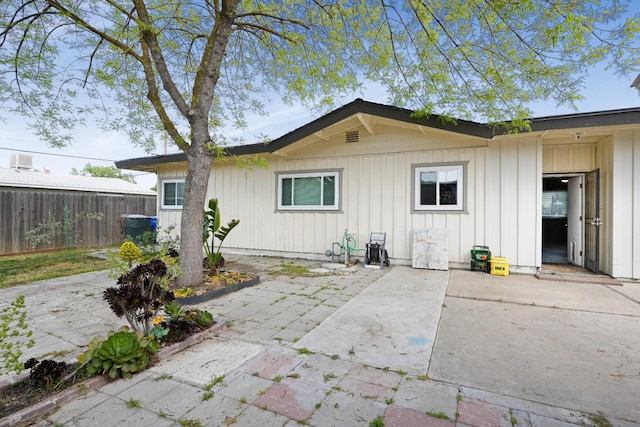 1016 N White, Hanford, CA 93230 - rear view of house with a patio area and board and batten siding
