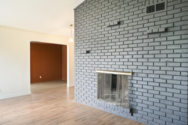 1016 N White, Hanford, CA 93230 - detailed view of wood finished floors and a brick fireplace