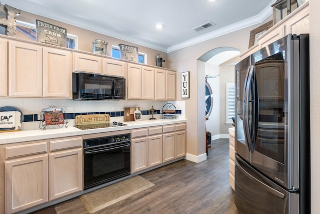 8194 N 5th St, Fresno, CA 93720 - kitchen featuring black appliances, crown molding, tasteful backsplash, arched walkways, and dark wood-style flooring