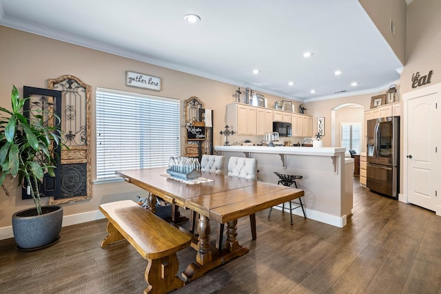 8194 N 5th St, Fresno, CA 93720 - dining area featuring arched walkways, ornamental molding, recessed lighting, and dark wood-type flooring