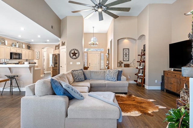 8194 N 5th St, Fresno, CA 93720 - living room with high vaulted ceiling, arched walkways, ceiling fan, dark wood-style floors, and recessed lighting