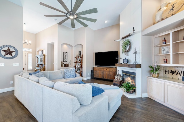 8194 N 5th St, Fresno, CA 93720 - living room featuring a ceiling fan, dark wood-style flooring, a chandelier, and a high ceiling
