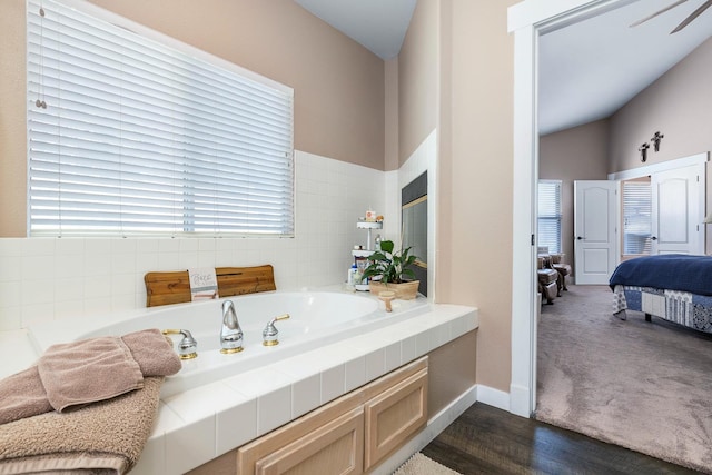 8194 N 5th St, Fresno, CA 93720 - ensuite bathroom with healthy amount of natural light, a garden tub, and wood finished floors