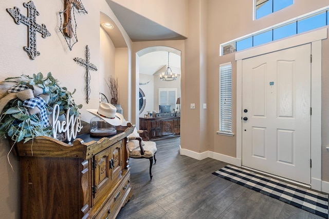 8194 N 5th St, Fresno, CA 93720 - foyer with dark wood finished floors, arched walkways, and a chandelier