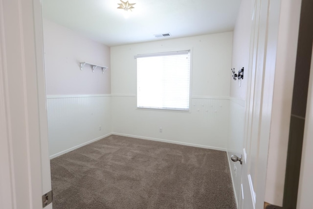 879 Hermosa Ave, Clovis, CA 93619 - carpeted empty room featuring a wainscoted wall