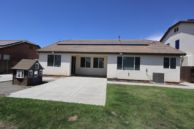 879 Hermosa Ave, Clovis, CA 93619 - rear view of house featuring a tiled roof, roof mounted solar panels, and a patio area