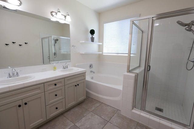 879 Hermosa Ave, Clovis, CA 93619 - full bath featuring a shower stall, a garden tub, double vanity, and tile patterned flooring