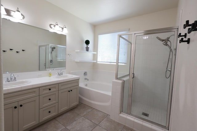 879 Hermosa Ave, Clovis, CA 93619 - bathroom featuring a stall shower, a bath, double vanity, and tile patterned floors