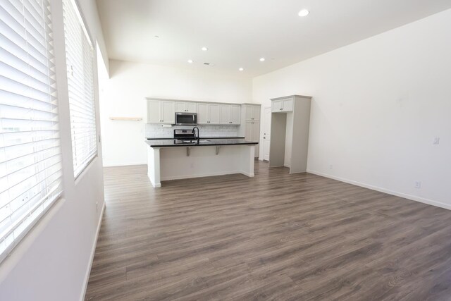 879 Hermosa Ave, Clovis, CA 93619 - unfurnished living room with recessed lighting and dark wood-style floors