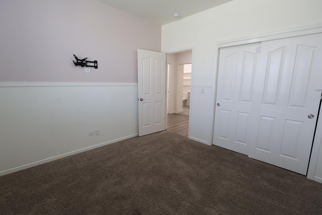 879 Hermosa Ave, Clovis, CA 93619 - unfurnished bedroom with carpet, a closet, and a wainscoted wall