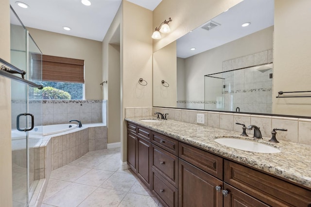 5857 W Modoc, Visalia, CA 93291 - full bath featuring a garden tub, double vanity, a stall shower, tile patterned flooring, and recessed lighting