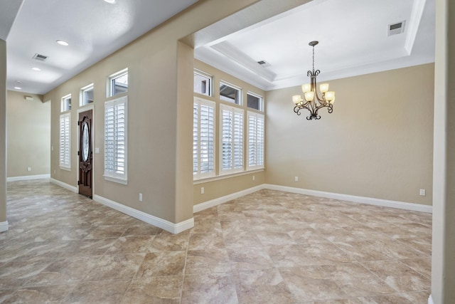 5857 W Modoc, Visalia, CA 93291 - foyer with healthy amount of natural light, a chandelier, a tray ceiling, crown molding, and recessed lighting
