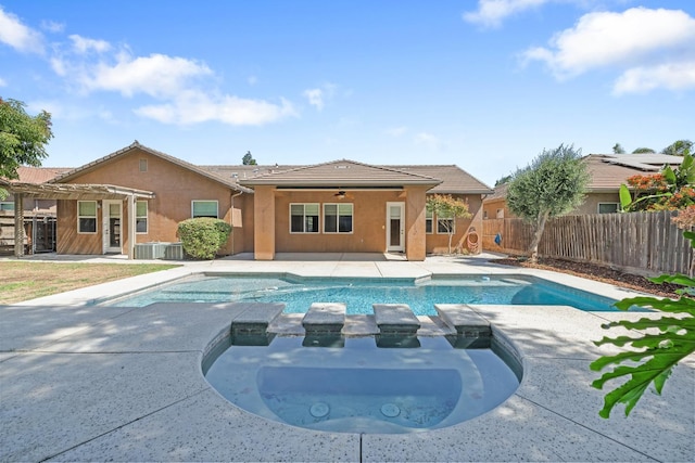 5857 W Modoc, Visalia, CA 93291 - view of swimming pool featuring a pergola, a fenced backyard, a patio, a ceiling fan, and a pool with connected hot tub