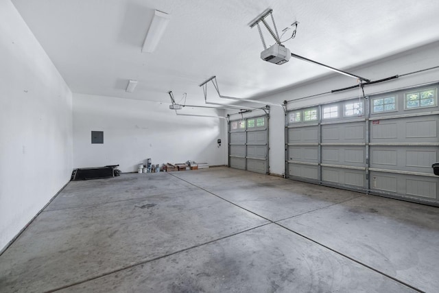 5857 W Modoc, Visalia, CA 93291 - garage featuring a garage door opener and electric panel