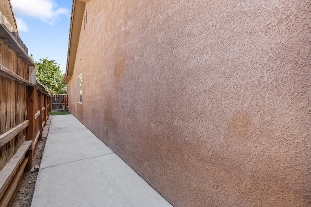 5857 W Modoc, Visalia, CA 93291 - view of side of home featuring stucco siding