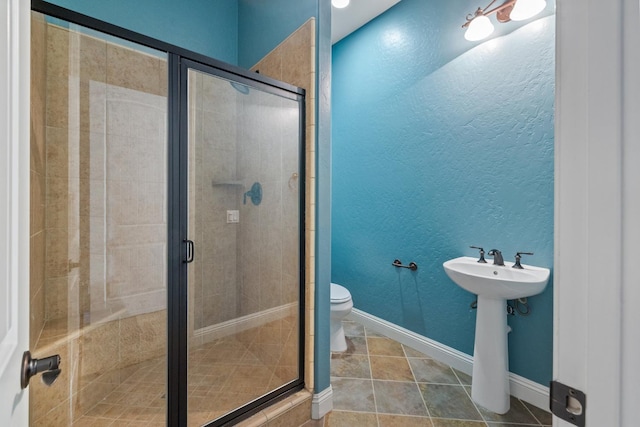 5857 W Modoc, Visalia, CA 93291 - full bath featuring a stall shower, a textured wall, and tile patterned floors
