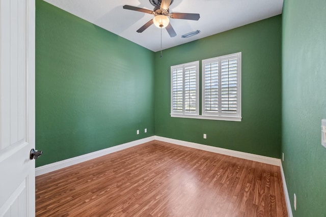 5857 W Modoc, Visalia, CA 93291 - unfurnished room with wood finished floors and ceiling fan