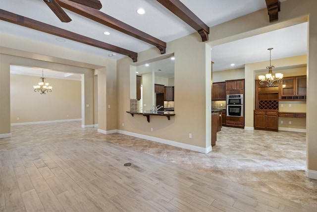 5857 W Modoc, Visalia, CA 93291 - unfurnished living room with a chandelier, beamed ceiling, ceiling fan, light wood-style floors, and recessed lighting