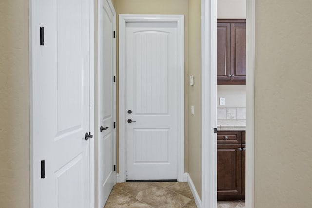 5857 W Modoc, Visalia, CA 93291 - hallway with a textured wall and light tile patterned flooring