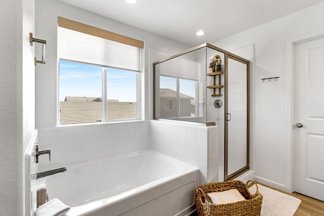 4086 Dennis Ave, Clovis, CA 93619 - bathroom with a bath, a shower stall, wood finished floors, and recessed lighting
