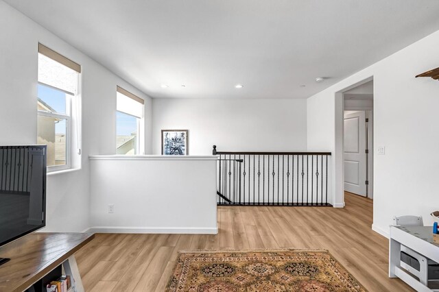 4086 Dennis Ave, Clovis, CA 93619 - hallway with light wood-style floors, an upstairs landing, and recessed lighting