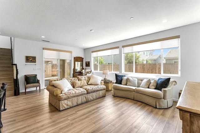 4086 Dennis Ave, Clovis, CA 93619 - living room with stairway, light wood-style floors, and recessed lighting