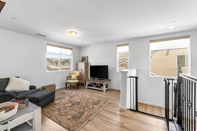 4086 Dennis Ave, Clovis, CA 93619 - living room with light wood finished floors and recessed lighting
