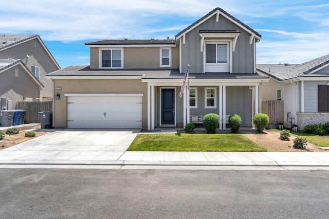 4086 Dennis Ave, Clovis, CA 93619 - traditional home featuring board and batten siding, covered porch, driveway, stucco siding, and a garage