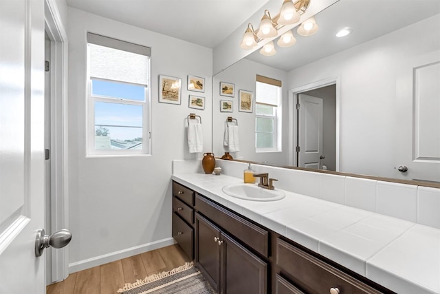 4086 Dennis Ave, Clovis, CA 93619 - bathroom with plenty of natural light, vanity, and wood finished floors