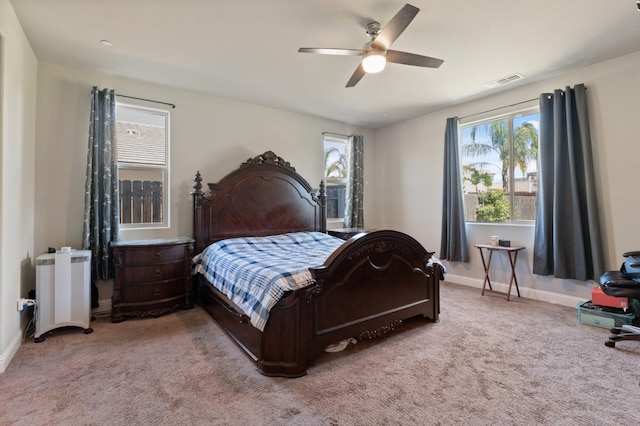 7330 E Princeton Ave, Fresno, CA 93737 - carpeted bedroom featuring multiple windows and ceiling fan