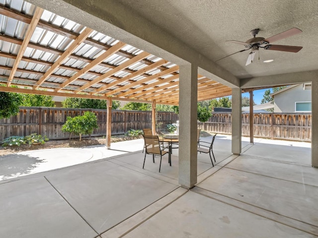 3807 N Pearwood Ave, Fresno, CA 93727 - fenced backyard featuring outdoor dining area, ceiling fan, and a patio area