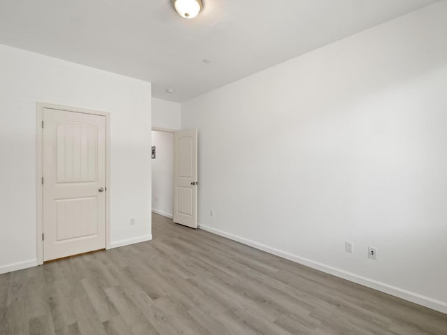3807 N Pearwood Ave, Fresno, CA 93727 - unfurnished bedroom featuring wood finished floors and baseboards