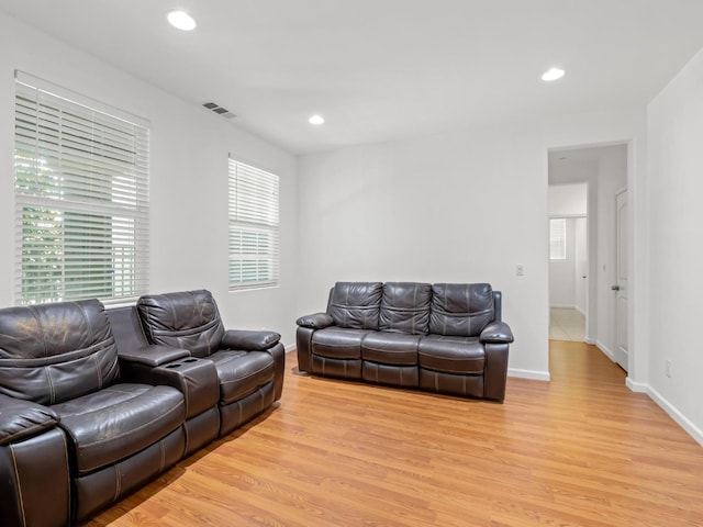 3807 N Pearwood Ave, Fresno, CA 93727 - living room with light wood-style floors and recessed lighting