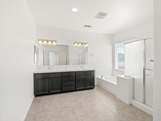 3807 N Pearwood Ave, Fresno, CA 93727 - full bath with a garden tub, double vanity, tile patterned floors, a stall shower, and recessed lighting