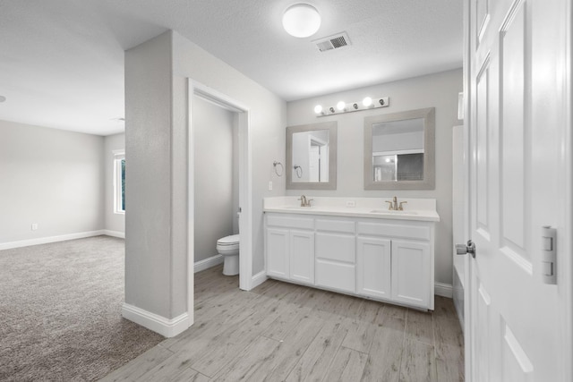 2720 San Jose Ave, Clovis, CA 93611 - full bathroom with double vanity and wood finished floors