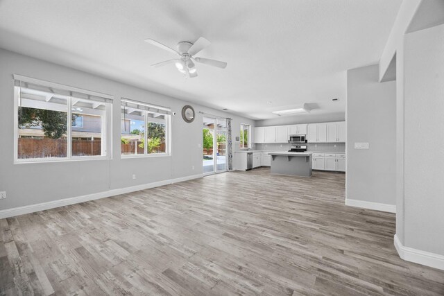 2720 San Jose Ave, Clovis, CA 93611 - unfurnished living room featuring light wood-type flooring and a ceiling fan